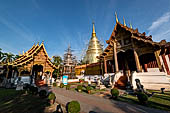 Chiang Mai - The Wat Phra Singh temple. The group of interesting buildings formed bay the  Ubosot and next to it the small attractive Viharn Lai Kham and the large gilded chedi. 